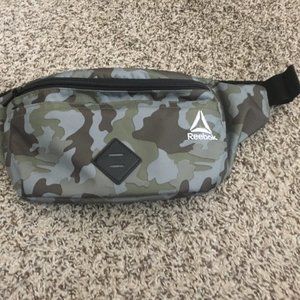 Reebok camo sling bag/fanny pack.  2 roomy front pockets and 1 back